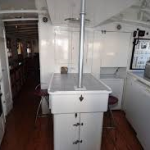 Galley aft of vessel right below the pilot house.
Engine is inside the center counter