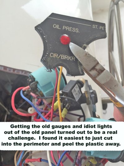 using wire cutters to remove gauges and lights from old panel.jpg