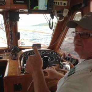 Enjoying inside at the helm