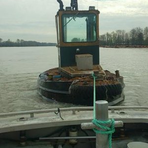 Assist MV Nitro towing a dozer boat to the shipyard. These little boat are like towing a rock, tough to pull in current, on a working river.