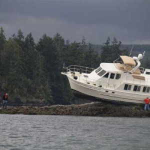 My current boat when it was new and named "Dream Weaver".  The new owner found this handy rock at high tide.