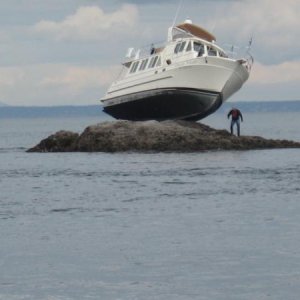 My current boat when it was new and named "Dream Weaver".  The new owner found this handy rock at high tide.