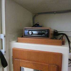 12 volt radio/CD player. That is a home made antenna behind the radio. I listen to a lot of podcast that are played though an IPOD connected to the ra