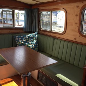 The boat had tons of interior water damage. Photo before installing Chilewich wallcovering. Also shown is temporary tabletop on adjustable base.