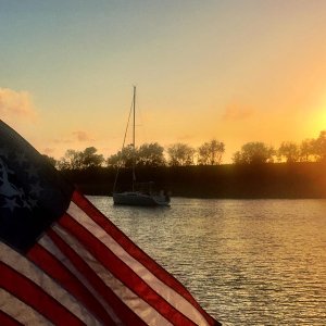 Flag at sunset on Clouter Creek, "home" of the Cruising Club of Charleston Annual Oyster Roast.