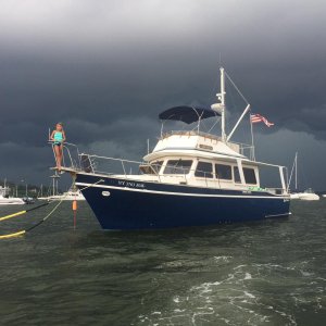 Blue wrapped vinyl hull, Extended fly bridge deck, mast and boom, etc