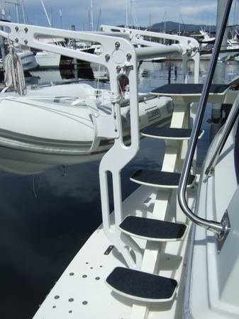 Custom stairs and custom dingy davits on extended swim grid