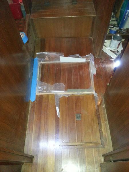 Here is a picture of the hatch with the spacer pieces, frame and hatch all in place, waiting for the glue and epoxy to set.  You can see the waxed pap
