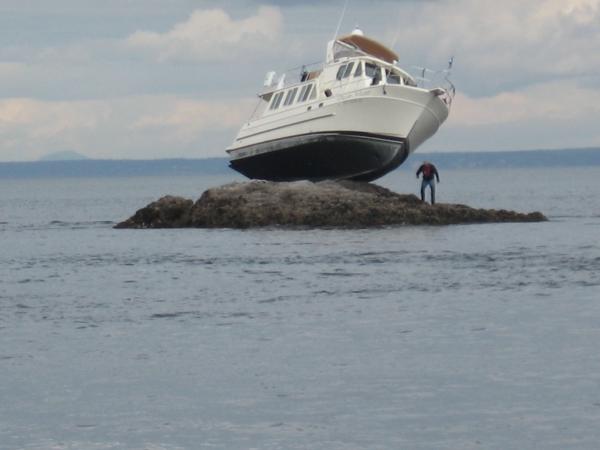My current boat when it was new and named "Dream Weaver".  The new owner found this handy rock at high tide.
