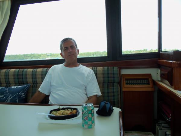 My Dad enjoying a Lean Cuisine at anchor in Manjack Cay