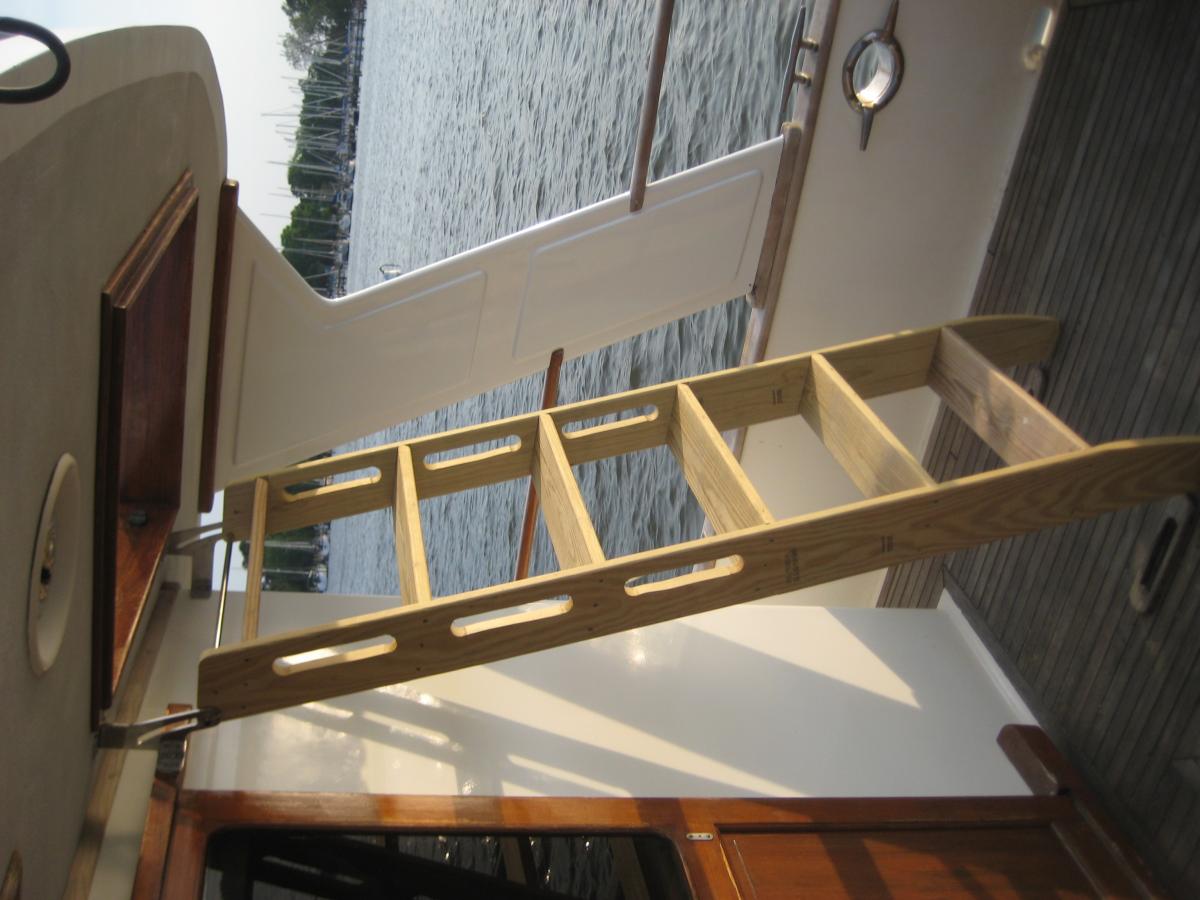 New permanent hinges are installed and carrying the model ladder.