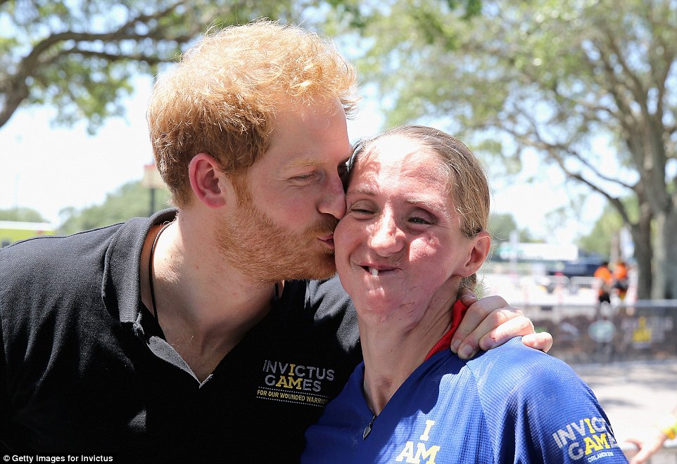 33FCC4E800000578-3583427-Prince_Harry_kissed_road_cyclist_Katie_Kuiper_right_a_former_ser-a-36_1462910053710.jpg