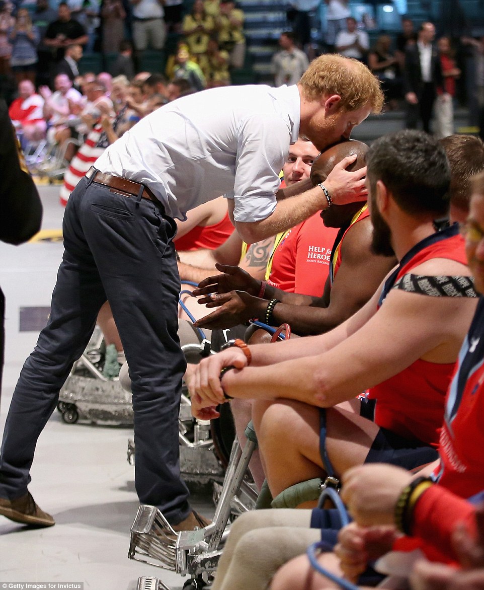 3411BDD200000578-3585336-ORLANDO_FL_MAY_11_Prince_Harry_presents_medals_to_the_USA_Wheelc-a-98_1463032916382.jpg