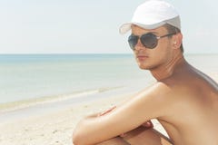 guy-wearing-black-glasses-beach-32943164.jpg