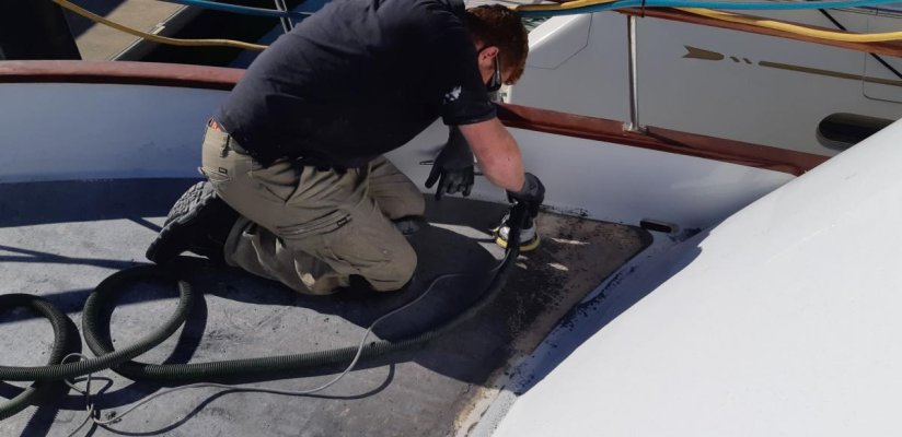 Sanding the black sticky back to clean glass.jpg