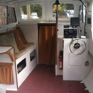 cabin int.; there's a small v-berth behind the curtain