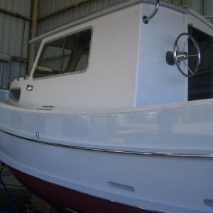 Port side of vessel.  Wheelhouse was repainted with Awlgrip.  Note new stainless steel rubrails.