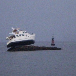 My current boat when it was new and named "Dream Weaver".  The new owner found this handy rock at high tide.