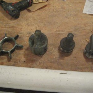 On the left are the two bronze castings from the original mast. On the right are the two aluminum castings from the spinnaker pole. In any case, it wi