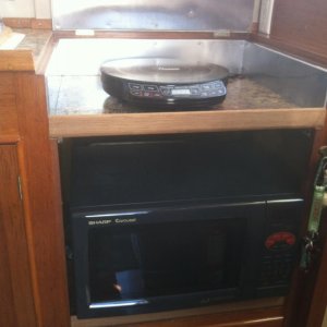 Propane stove/cooktop removed

Installed:
Combination microwave & convection oven.
Induction cooktop - no burned hands, works great!
