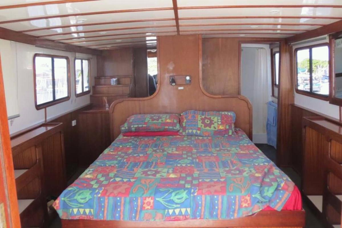 Master cabin top deck looking fwd to wheelhouse
Bathroom to the right
Bed has since been widened to a king
Behind photographer is a sizeable sun deck 